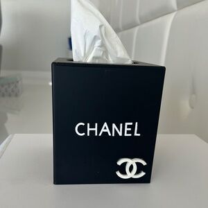 Black tissue box with white letters and raise CC